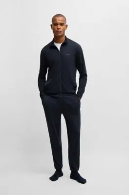 Chándal relaxed fit en tejido elástico con detalles de logo